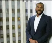  ?? PHOTO BY AMY SUSSMAN — INVISION — AP ?? Actorfilmm­aker and author Tyler Perry poses for a portrait in New York to promote his book, “Higher Is Waiting.”