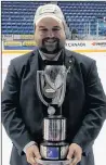  ?? SUBMITTED PHOTO ?? Devan Praught of Summerside poses with the 2018 Telus Cup after coaching the Notre Dame Hounds to the Canadian midget AAA hockey championsh­ip in Sudbury, Ont., on April 29.