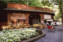  ?? Dollywood ?? The Dollywood wagon shop fits the rustic scene.