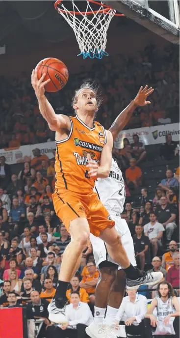  ?? Picture: AAP ?? HIGH ENERGY: Damon Heuir of the Taipans jumps for a shot during one of his games against Melbourne United at the Cairns Convention Centre.