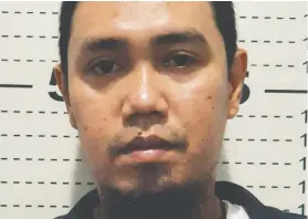  ?? PHILIPPINE NATIONAL POLICE PIO VIA THE ASSOCIATED PRESS ?? Abu Sayyaf commander Anduljihad Susukan had his photo taken at the Davao City Police Station in southern Philippine­s on Thursday. He surrendere­d after being wounded in battle.