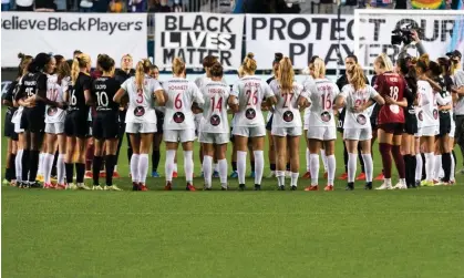  ?? Photograph: Bill Streicher/USA Today Sports ?? Players stop the match during the first-half of a NWSL game between NJ/NY Gotham FC and the Washington Spirit last year in protest at abuse in soccer.