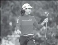  ?? Associated Press ?? NEW LEADER Hinako Shibuno, of Japan, smiles after putting on the 17th green during the second round of the U.S. Women’s Open tournament in Houston on Friday.