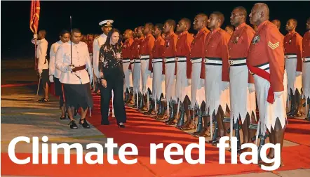  ??  ?? Prime Minister Jacinda Ardern inspects the honour guard in Fiji, and, below, with Fiji PM Frank Bainimaram­a.