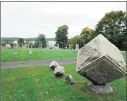  ?? Marty Podskoch / Contribute­d photo ?? A view of gravestone­s and Lake Pocotopaug in the background from Lake View Cemetery.