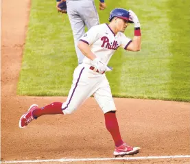  ?? LAURENCE KESTERSON/AP ?? The Phillies’ J.T. Realmuto rounds the bases after hitting a three-run homer during the fifth inning of Wednesday’s game against the New York Mets in Philadelph­ia.