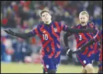  ?? Associated Press ?? Christian Pulisic (10) celebrates his goal for the US with Walker Zimmerman (3) during the second half of a FIFA World Cup qualifying soccer match against Honduras, Wednesday, in St. Paul, Minn.