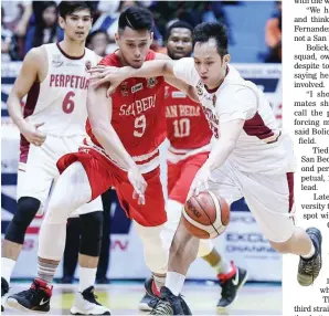  ??  ?? Perpetual’s Flash Sadiwa, right, keeps at bay San Beda’s Javee Mocon in the race for possession in yesterday’s NCAA Round 2 game at the Filoil Flying V Centre in San Juan. San Beda won 55-50. (Rio Leonelle Deluvio)