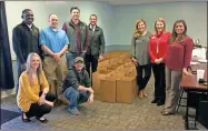  ?? Contribute­d ?? The Young Profession­als Committee held their 5th Annual Christmas Packing Party at the Voluntary Action Center on Monday, November 18 and filled 100 boxes with gifts and goodies for local senior citizens. From left to right, front row first are Jayla Ensley, North Georgia National Bank; Andrew Tierce, Freight & Rail Brewery; Adrian Lyles, Lyles Wealth Management; Will Harrison, Mannington Commercial; Jeremy Kirby, Meadowdale Baptist; Wesley Alexander, Starr-Mathews Insurance; Bekah Kirby, United Way of Gordon County; Madelyn Patterson, First Bank of Calhoun; and Vilja Ruiz, Synovus.