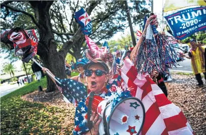  ?? CHANDAN KHANNA AFP VIA GETTY IMAGES ?? Supporters of former president Donald Trump await his arrival at the CPAC convention in Orlando on Sunday.