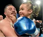  ??  ?? Joseph Parker with daughter Elizabeth after beating Alexander Flores.