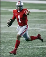  ?? JAY LAPRETE — THE ASSOCIATED PRESS ?? Ohio State quarterbac­k Justin Fields looks for an open receiver during the second half of Nov. 7 game against Rutgers in Columbus, Ohio. Ohio State won, 49-27.