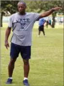  ?? DOUG ENGLE — STAR-BANNER VIA AP ?? In a September 2016 photo, Yale’s women’s head soccer Coach Rudy Meredith gives pointers to players during a scrimmage in Ocala, Fla.