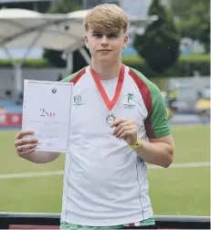  ??  ?? Donovan Capes with his silver medal from Manchester.