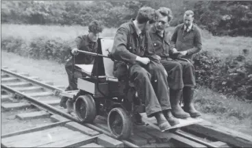  ??  ?? Above: Dick provides the propulsion for fellow members Dick Gurney and Colin Mann on the Wickham trolley.