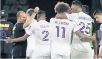  ?? STEPHEN M. DOWELL/ORLANDO SENTINEL ?? Orlando City coach Oscar Pareja and players celebrate after winning an MLS is Back Tournament match against Minnesota United.