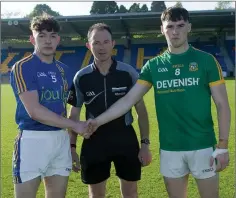  ??  ?? Wicklow captain Conor Byrne and Meath captain Darragh Campion with referee John Hickey from Carlow.