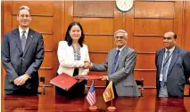  ??  ?? Visiting MCC MD Ms. Caroline Nguyen and Treasury Secretary Dr. R.H. Samaratung­a (second from right) after signing the agreement flanked by US Embassy and Treasury officials.