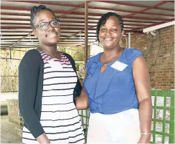  ??  ?? Recipient of the American Women’s Group Scholarshi­p Mickalia McKoy (left) and her proud mother, Debbie.