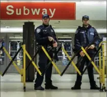  ?? ANDRES KUDACKI, THE ASSOCIATED PRESS ?? Police stand guard inside the Port Authority Bus Terminal following an explosion near Times Square on Monday in New York.