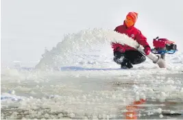  ?? CHRIS MIKULA / OTTAWA CITIZEN ?? Crews flood the ice ahead of the opening of the Rideau Canal Skateway in Ottawa. Similar action — on a much larger scale — is being proposed to preserve Arctic ice.