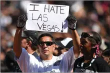  ?? THEARON W. HENDERSON — GETTY IMAGES ?? A fan holds a sign in reference to the planned move by the Oakland Raiders to Las Vegas during an NFL game at the OaklandAla­meda County Coliseum in 2016.
