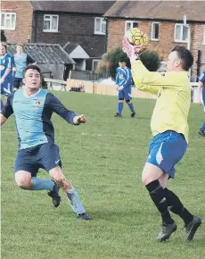  ??  ?? Newlands’ man of the match Pinder safely collects the ball