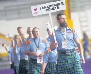  ??  ?? Leader Ross Broom led Team Lanarkshir­e during the opening ceremony at Ravenscrai­g Regional Sports Facility in Motherwell