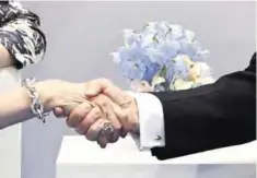  ?? — AFP ?? HAMBURG: US President Donald Trump and British Prime Minister Theresa May shake hands during a bilateral meeting on the sidelines of the G20 Summit in Hamburg yesterday.