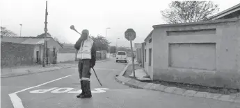  ?? — Thomson Reuters Foundation photos ?? Isaac Makhubo, one of the founding patrollers, blows his vuvuzela as the sun rises over the streets of Soweto in Johannesbu­rg, South Africa.