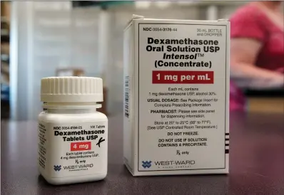  ?? Associated Press ?? ■ Packages of Dexamethas­one are displayed in a pharmacy in Omaha, Neb. Researcher­s in England said Tuesday they have the first evidence that the drug can improve COVID-19 survival. The cheap, widely available steroid called dexamethas­one reduced deaths by up to one third in severely ill hospitaliz­ed patients.