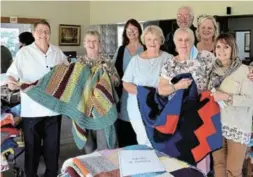  ?? Picture: ROB KNOWLES ?? KEEPING COSY: The Damant Lodge Ladies knit blankets and donate them to worthy causes in the area. This year, their blankets were shared between, from left, Craig Ellis and Dini Hartleb of the Port Alfred Soup Kitchen, back, Amanda van Rhijk and Hennie Delport of Huis Dias, front, Jill Reed and Liz Coombes-Heath of Loaves and Fishes, Susan Harty of Child Welfare, back, and Tania Khats of Huis Dias