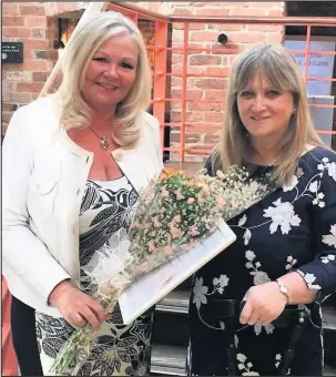  ??  ?? Jane is pictured left, presenting the money she raised to Maria Hanson for the Me and Dee charity.