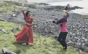  ??  ?? Darcey Bussell in her programme Wild Scottish Coast, including an impromptu Bollywood dancing class with Meena Watts, above