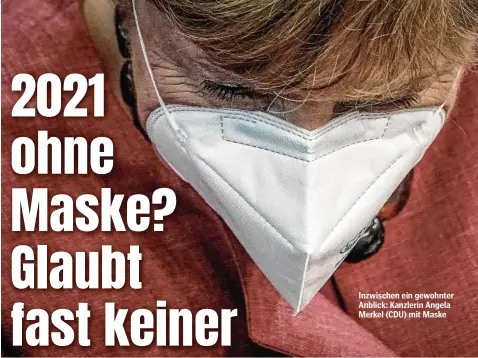  ??  ?? Inzwischen ein gewohnter Anblick: Kanzlerin Angela Merkel (CDU) mit Maske