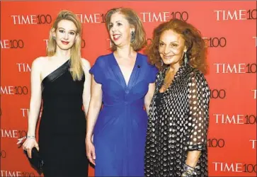  ?? Timothy A. Clary AFP/Getty Images ?? ELIZABETH HOLMES, left, the founder of Theranos, with Nancy Gibbs and Diane von Furstenber­g at a New York event in 2015. Holmes was convicted Monday on multiple counts of defrauding her investors.