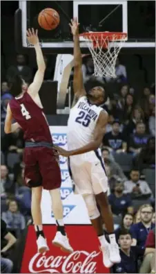  ?? CHRIS SZAGOLA — THE ASSOCIATED PRESS ?? Villanova’s Mikal Bridges, right, defends the basket Lafayette’s Eric Stafford, left, Friday in Allentown. against