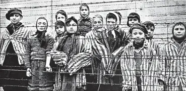  ??  ?? Survivors of hell: Jewish children at Auschwitz in 1945