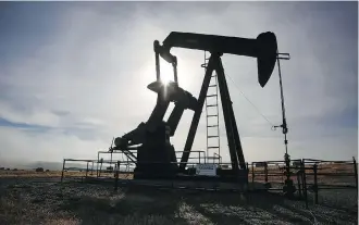  ?? JEFF MCINTOSH/THE CANADIAN PRESS FILES ?? Oil and gas firms are realizing they must adapt to stay in the game, as they face new industry rules since cheap energy is abundant and competitio­n from new sources arise.