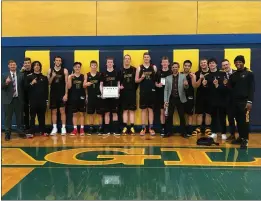  ?? CONTRIBUTE­D ?? The College of the Redwoods men’s basketball team takes a team photo following its 81-78 John Houge Memorial Tournament championsh­ip win over Mendocino, Saturday night in Ukiah.