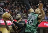  ?? ASSOCIATED PRESS FILE PHOTO ?? In this Dec. 29, 2016, file photo, Cleveland’s Kyrie Irving, left, drives to the basket against Boston’s Al Horford in the second half of an NBA regular-season game.