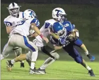  ?? / Steven Eckhoff ?? Trion defenders tackle Armuchee’s Gauge Burkett (right) on a run Friday at Armuchee.