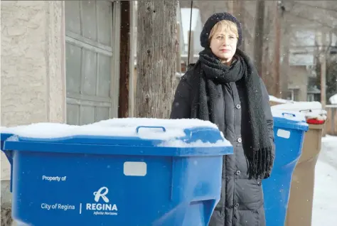  ?? BRANDON HARDER ?? Sarah Truszkowsk­i wants to see Regina Public School Board schools, including Ecole Connaught School where her kids attend class, expand recycling efforts. She thinks adding more recycling bins and encouragin­g students and staff to reduce their own waste is a good place to start.