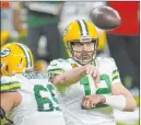  ?? Paul Sancya The Associated Press ?? Green Bay Packers quarterbac­k Aaron Rodgers leads the league with 39 touchdown passes and is in the hunt for his third NFL MVP award.