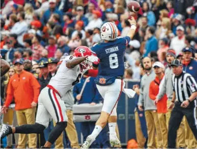  ?? GEORGIA PHOTO/CAITLYN TAM ?? Georgia inside linebacker Natrez Patrick (6) pressures Auburn quarterbac­k Jarrett Stidham during Auburn’s 40-17 win last November. The Bulldogs avenged that defeat three weeks later in the SEC championsh­ip game.