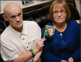  ??  ?? Duncan and Margaret Spiers with picture of their son Christophe­r