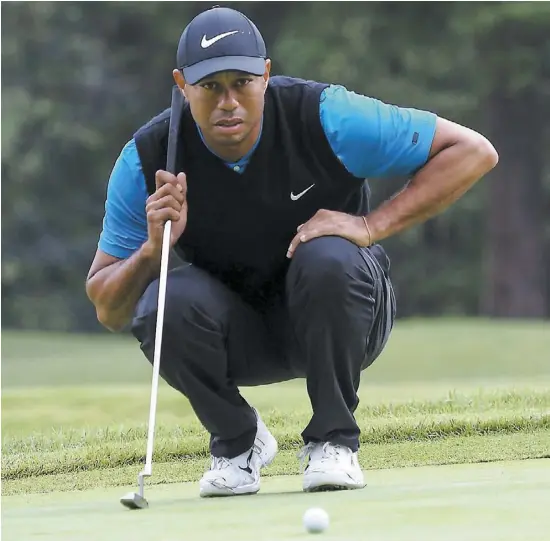  ?? PHOTO AFP ?? Le golfeur américain Tiger Woods a remporté le 82e tournoi de sa carrière hier, égalant ainsi la marque de Seam Snead.