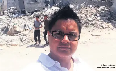  ??  ?? > Kerry-Anne Mendoza in Gaza