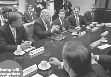  ?? CHIP SOMODEVILL­A, GETTY IMAGES ?? President Trump met Monday with, left to right, Wendell Weeks of Corning, Alex Gorsky of Johnson & Johnson, Michael Dell of Dell Technologi­es, Mario Longhi of U. S. Steel and other business leaders at the White House. Trump will renegotiat­e NAFTA, 6A