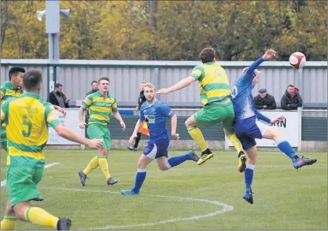  ??  ?? 1 0 Leek Town’s Rob Stevenson, centre, looks on as striker Aaron Bott challenges for the ball during Saturday’s match against Runcorn Linnets in the Evo-stik League. Picture and reports: Steve Reynolds